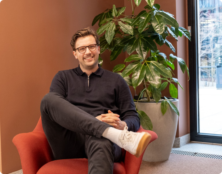 man smiling in chair